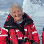 Photograph of Philippa Foster Back in front of an iceberg