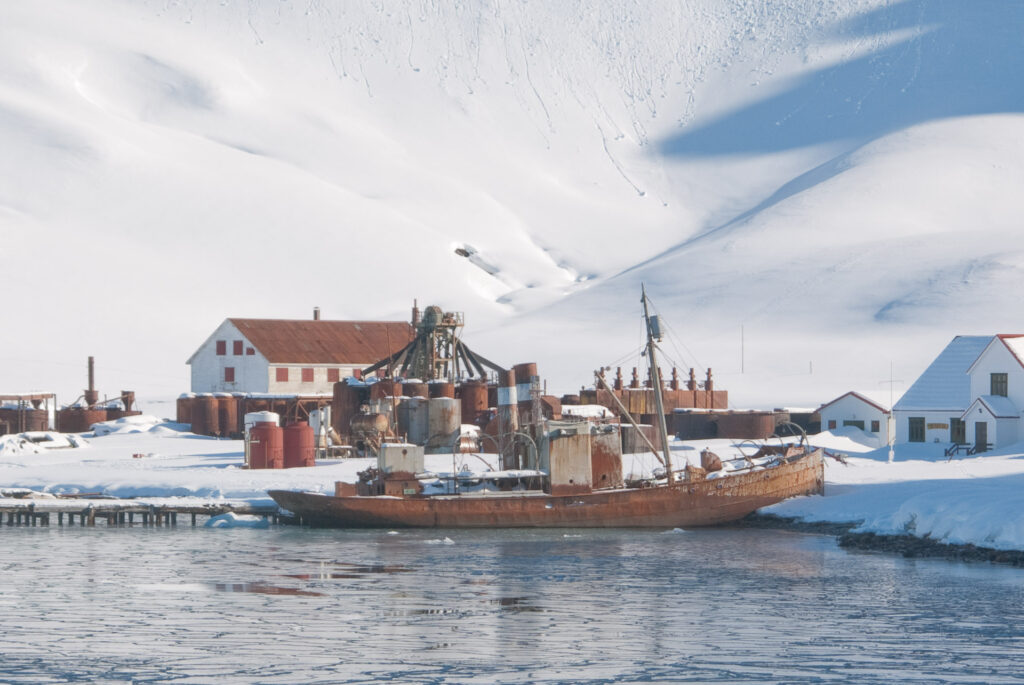 Rusty shipwreck on a beach in winter